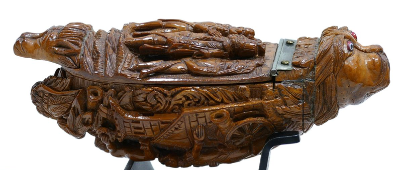 Side view of the carved coquilla nut snuff box